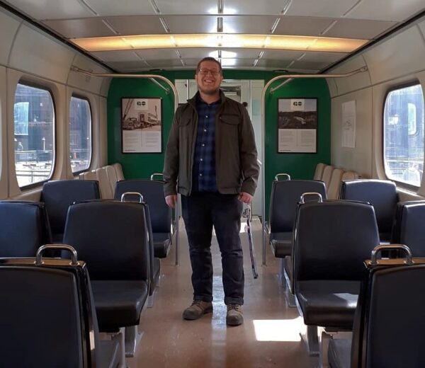 A man standing in a train car